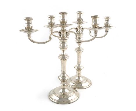 A pair of modern silver three-light candelabra,by William Comyns &amp; Sons Ltd, London 1967,in the George I manner, knopped 