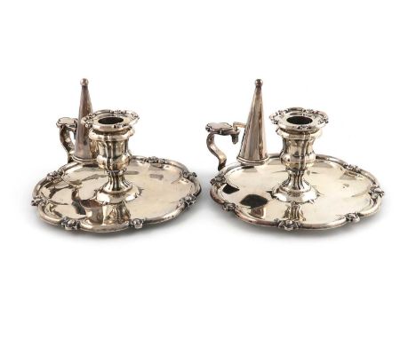 A pair of Victorian silver chambersticks,by Henry Wilkinson &amp; Co, Sheffield 1856,octofoil form, central baluster capitals