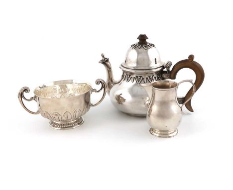 A matched three-piece tea set,various dates and makers, comprising: a teapot, by Charles &amp; Richard Comyns, London 1926, a