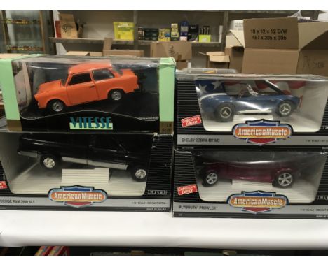 Three ERTL American Muscle 1/18 scale diecast cars: Shelby Cobra 427 SC; Plymouth Prowler; 1995 Dodge Ram 2500 SLT (loose in 