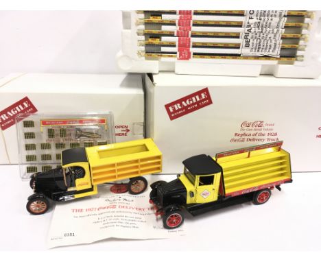 Two Danbury Mint 1/24 scale Coca Cola Delivery Trucks: 1927 #0351 (with certificate); 1928 (box with one inner end flap missi