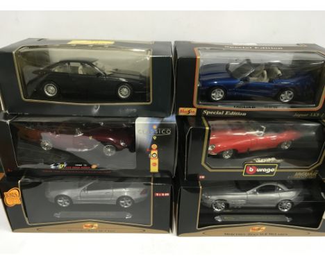 Six 1/18 scale diecast cars by Maisto, Bburago and Shell, includes Jaguar XK8 and BMW 850i. Appear VG+ and boxed (some wear t