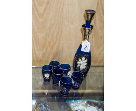 Murano Glass Decanter Set comprising decanter and six tot glasses. With enamelled floral decoration and gilt trim. 