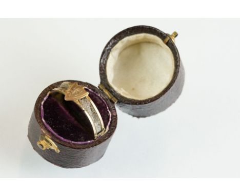 19th century mourning ring, plaited hair applied to the shank, initialled shield-shaped cartouche, three engraved foliate scr