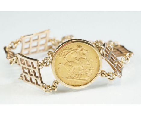 Full sovereign coin 9ct yellow gold bracelet, Victoria 1887, the bracelet formed of six waffle panels, bolt ring clasp and sa