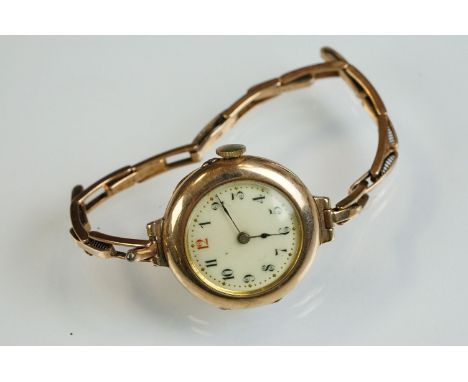 9ct rose gold cased watch, white enamel dial, black Arabic numerals, poker hands, 9ct gold expandable bracelet strap 