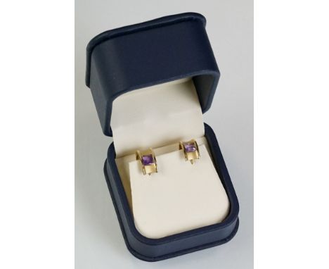 Pair of amethyst 9ct gold earrings, the square mixed step cut amethyst measuring approx 4.5mm x 4.5mm, flush set, matt and po