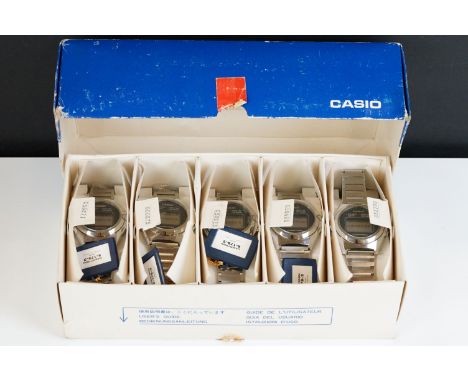 Casio branded trade box containing four Casiotron watches ref R-17B-2 (3 blue and 1 deep blue) and one ref R-17B-5 (deep brow
