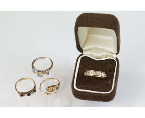 Four gem and paste set 9ct yellow and white gold dress rings, to include a ring modelled as a lioness head (4)