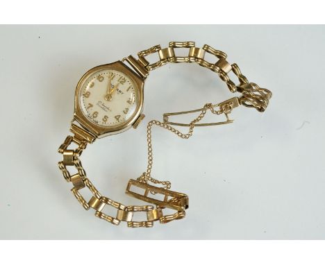 Rotary 9ct yellow gold ladies wristwatch, cream circular dial, gilt Arabic numerals and hands, 9ct gold bracelet strap (strap