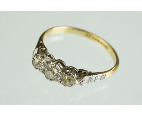 Diamond 18ct yellow gold platinum set three stone ring, illusion set, ring size M½ 