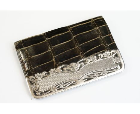 Edwardian silver mounted crocodile leather ladies purse, the silver mount with pierced &amp; scrolling floral detail and engi
