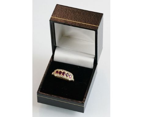 Ruby and diamond 18ct yellow gold ring, five oval mixed cut rubies to the centre, eight cut diamond surround, flush settings,