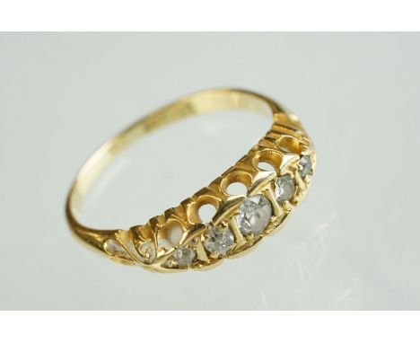 Diamond unmarked gold five stone ring, five graduated round mixed cut diamonds, coronet setting, assessed as 18ct gold, ring 