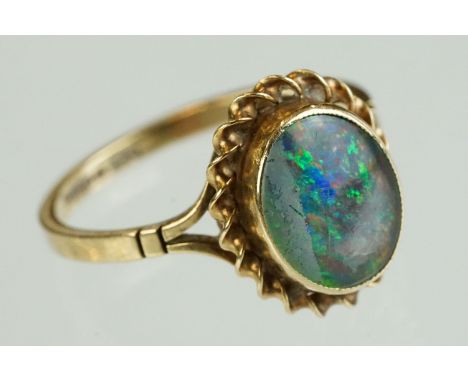 Opal triplet 9ct yellow gold ring, the opal displaying violet, indigo, blue, yellow, green, orange and red play of colour, co