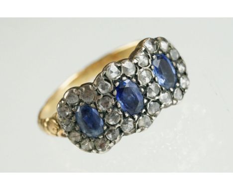 Georgian-style sapphire and diamond yellow gold three stone cluster ring, three oval mixed cut blue sapphires, measuring appr