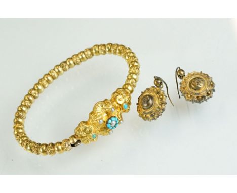 Victorian turquoise and seed pearl yellow metal bangle, split seed pearl and turquoise flower head cluster to the centre, tur