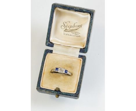 Early 20th century diamond and sapphire 18ct yellow gold and platinum set three stone ring, the round old cut diamond weighin