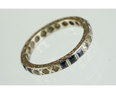 Sapphire and white stone 9ct white gold eternity ring, square cut sapphires in rows of three, round cut white stones in rows 