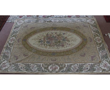 A woolwork tapestry with acanthus border and central oval floral panel, 83" x 59"