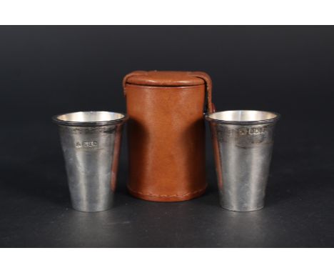 Two travelling Scottish silver shot cups in original leather case, hallmarked