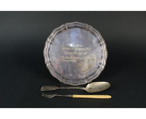 A small silver salver with presentation inscription, a silver spoon plus a silver pickle fork