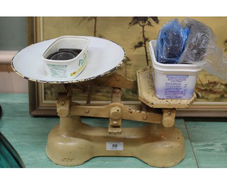 A set of kitchen scales plus a quantity of assorted weights