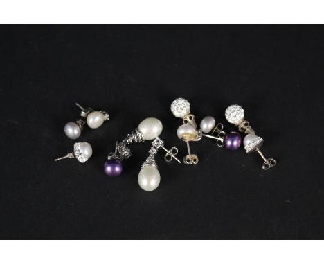 Six pairs of silver earrings, most pearl set