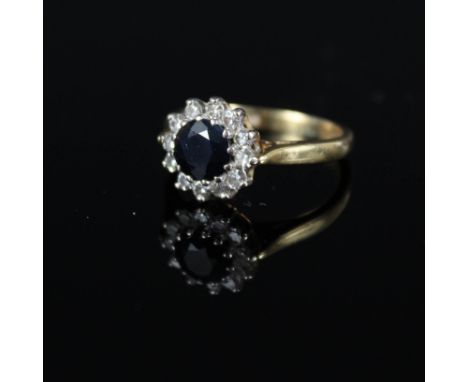 An 18ct gold sapphire and diamond ring, size K