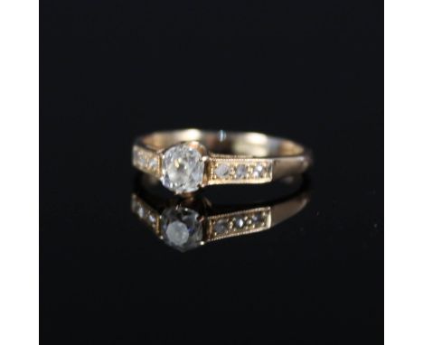 A 15ct gold diamond solitaire ring, the central old cut diamond approx 0.3cts with diamond set shoulders, size K