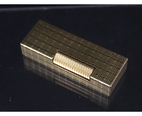 A gold plated Dunhill lighter