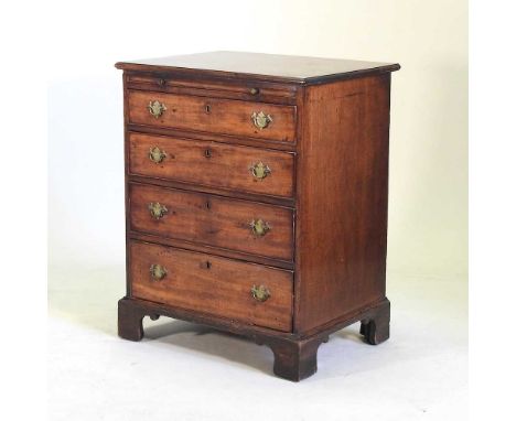 A George III mahogany bachelor's chest, of small proportions, fitted with a brushing slide, over four long drawers, on bracke