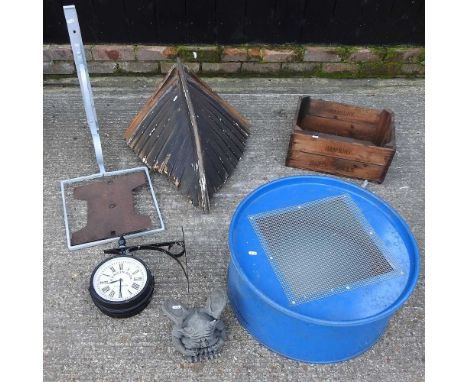 A painted iron bracket, 68cm, together with a fruit tray, a metal sieve, a wall clock, a gargoyle and the bow of a wooden row