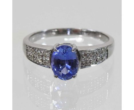 An 18 carat gold sapphire and diamond ring, 4.4g, size R, boxed with certificate