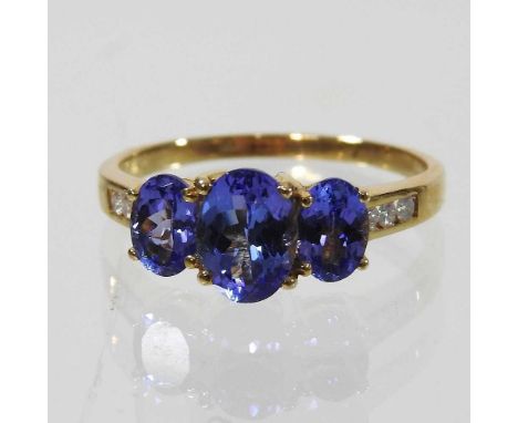 An 18 carat gold and tanzanite ring, 3.9g, size R, with certificate