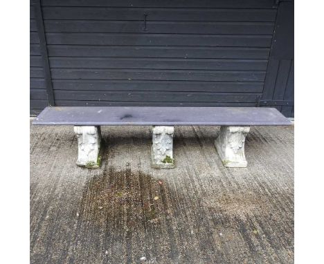A black slate garden bench, on three cast stone supports39cm wideCondition report: Is complete and usable. Weathered. Looks t