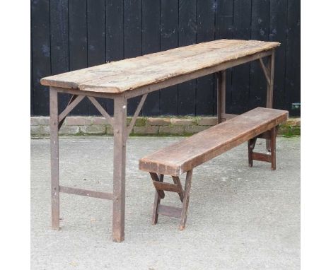 A rustic table, with a plank top, together with a folding bench256w x 52d x 99h cm