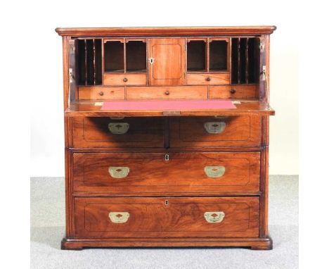 A 19th century fruitwood military campaign secretaire chest, in two sections, with a dummy drawer, concealing a fitted interi