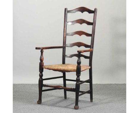 A Lancashire style ladderback armchair, early 20th century, with a rush seat59w x 46d x 122h cmCondition report: Overall comp