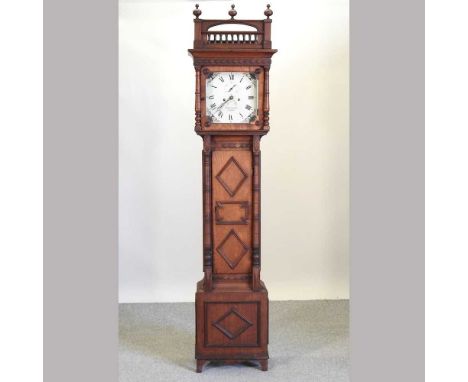 A late 19th century walnut cased longcase clock, having an eight day movement and geometric moulded case, with a painted dial
