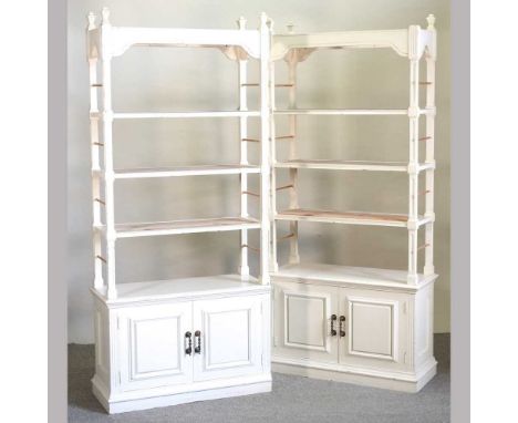 A pair of white painted open bookcases, with cupboards below (2)93w x 40d x 208h cmCondition report: They are solid and usabl