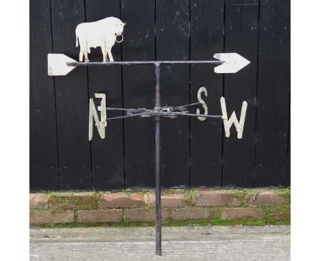 A painted metal weather vane, surmounted by a bull, 100cm high