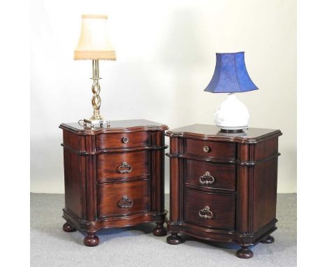 A pair of modern serpentine bedside chests, together with two table lamps (4)69w x 47d x 81h cmCondition report: Both cabinet