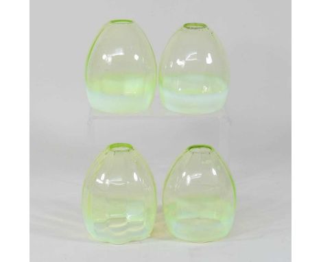 A set of four early 20th century green and vaseline glass shades, each 13cm highCondition report: All are dirty with light su