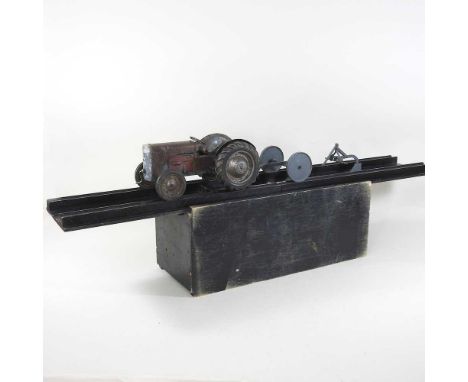 A 1950's Ferguson Tractor Demonstration Model salesman's scale model tractor, by Mills of Sheffield, 27cm long, with a wind u