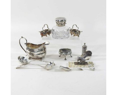 A George III silver cream jug, of helmet shape, marks rubbed, 123g, 14cm long, together with an elephant tooth paperweight, s