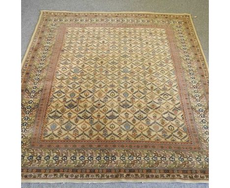 A modern Persian design carpet, with all over lozenges, on a pale ground, 244 x 201cmCondition report: Overall is dirty and s