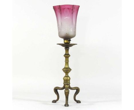 An Art Nouveau brass table lamp, with a red etched glass shade, stamped Winn and Birm, 43cm high overall
