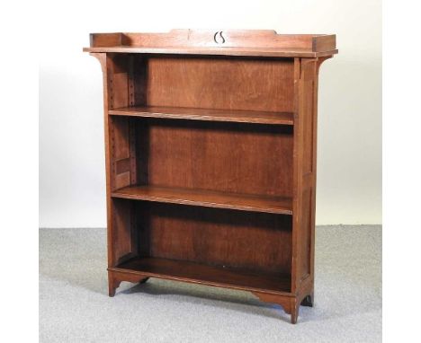 An Arts and Crafts style light oak dwarf bookcase, with a 3/4 gallery107w x 30d x 120h cmCondition report: Overall solid and 