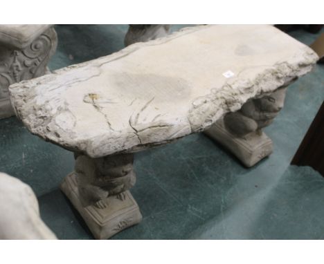 Wood effect garden bench on squirrel supports